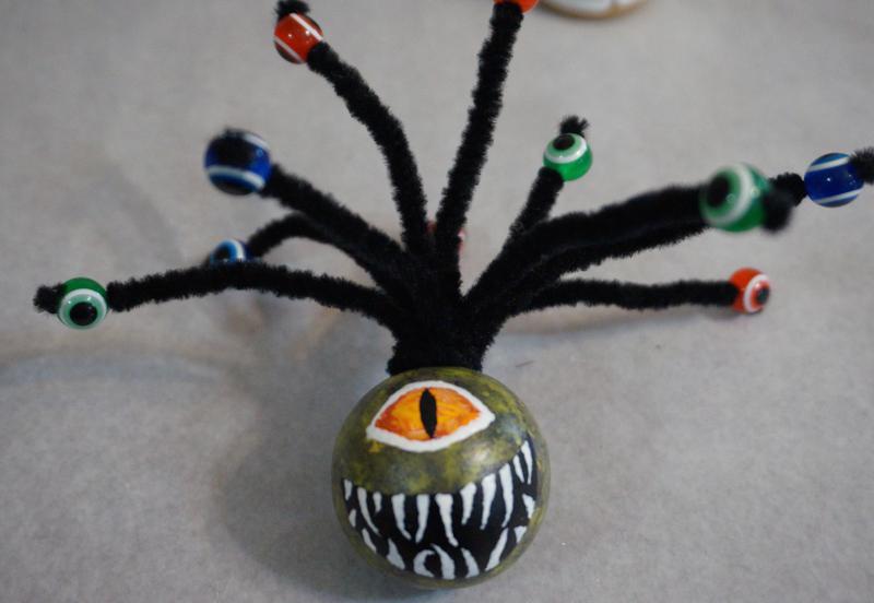 Beholder created with pipecleaners and beads that look like eyeballs