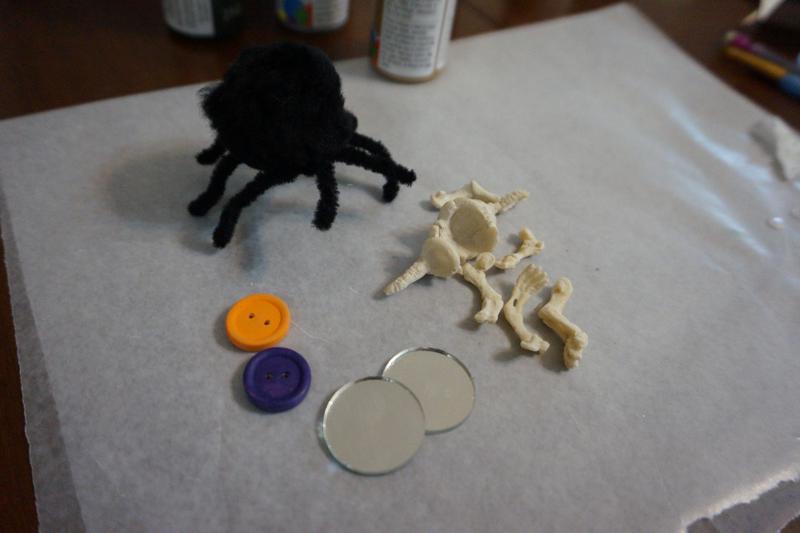Buttons, cottonball spiders, bones, and mirrors
